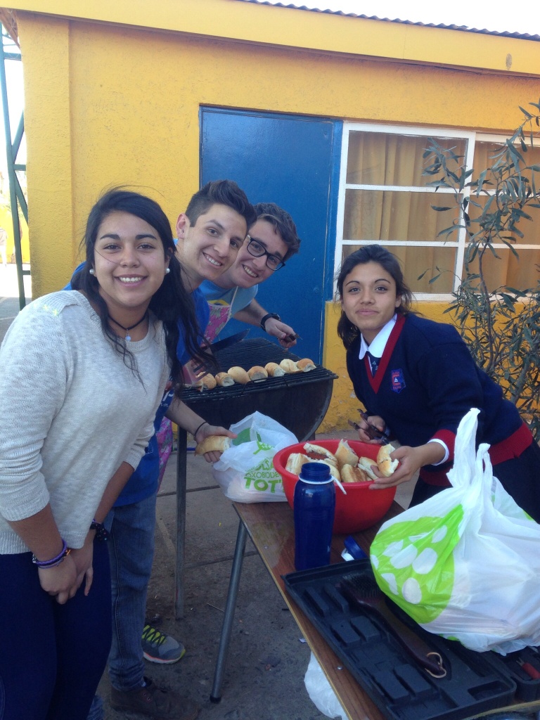 12th graders grilling chorizo. They sell this for their own personal profit and the school allows it!
